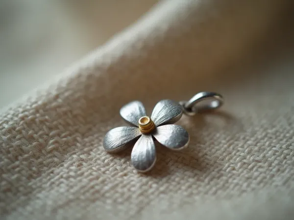 The tiny detail on your handmade flower pendant that proves it is fake